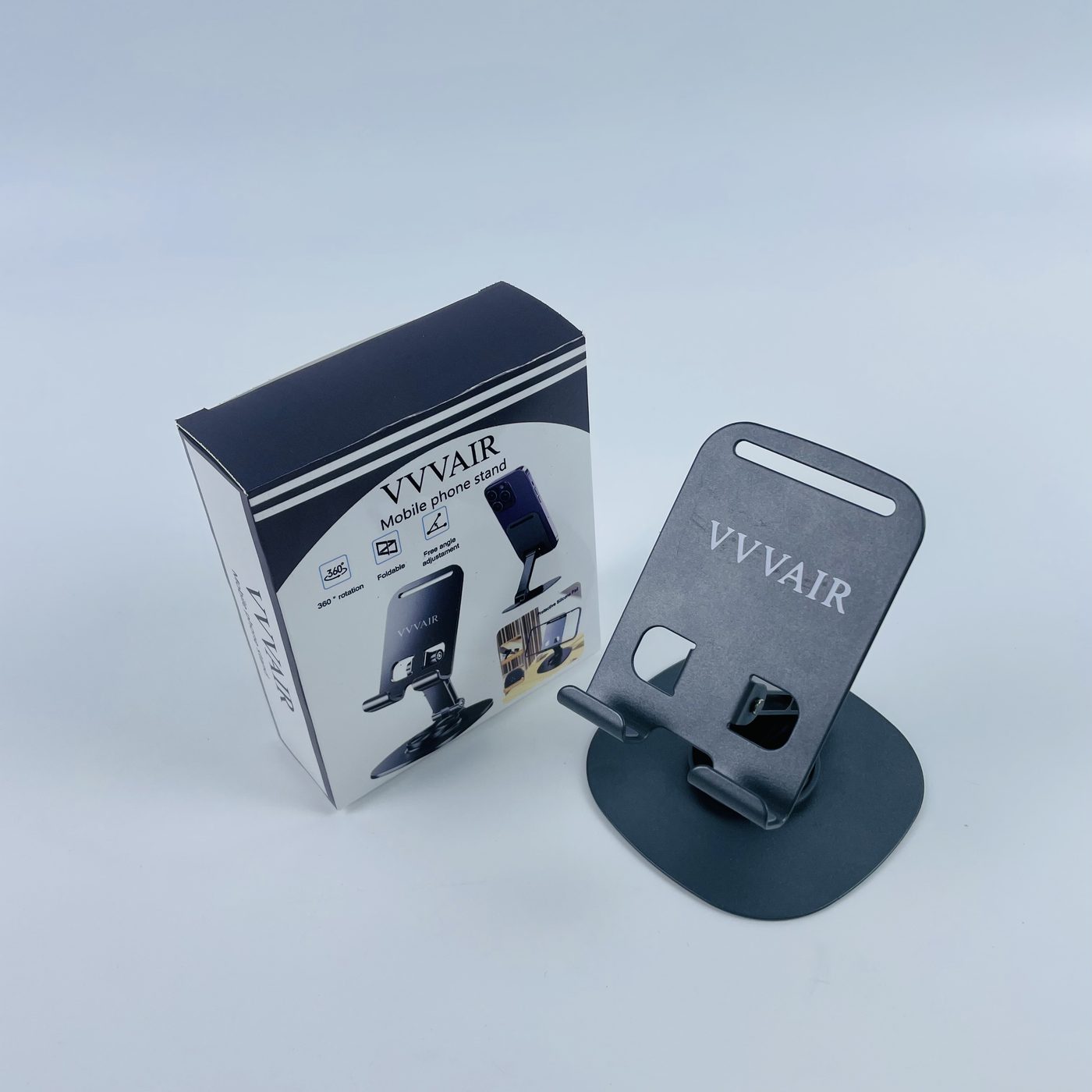 The printed box standing upright beside the assembled Space Black stand