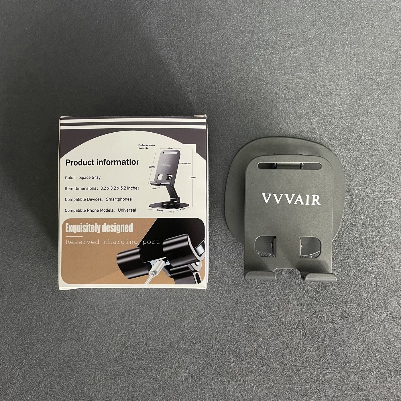 The product information panel printed on the box, next to the Space Gray stand